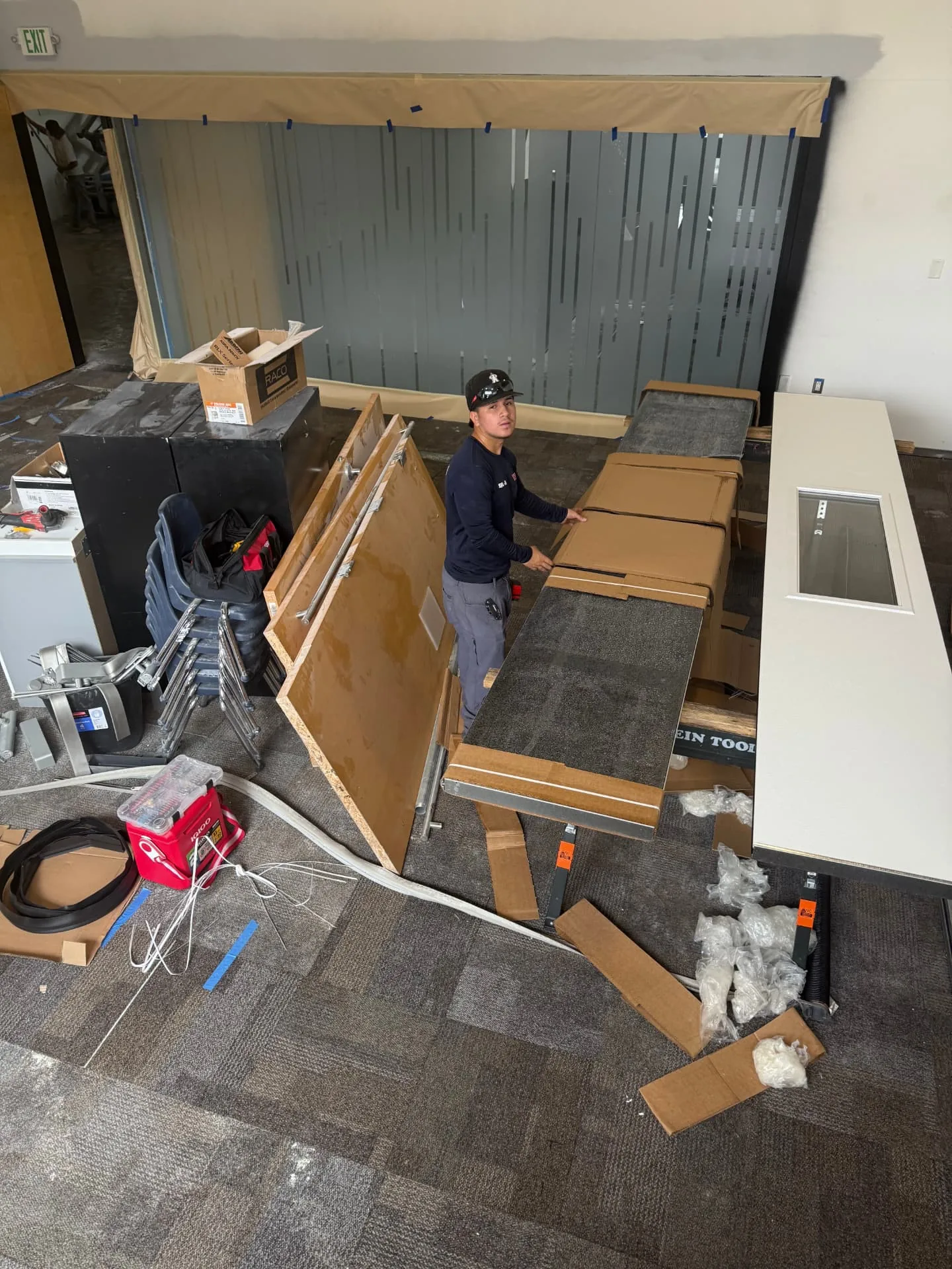 AZ Garage Door Pros technician repairing a garage door in New River, AZ
